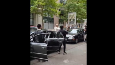 Susținătorii liderului AUR, scandal cu manele în fața unei secții de vot din Bruxelles: "Hai, Simioane!" VIDEO